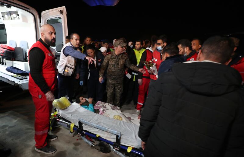 Tunisian medics transfer an injured Palestinian man evacuated from the Gaza Strip, upon their arrival at Tunis-Carthage International Airport, Tunisia, December 3 2023. EPA