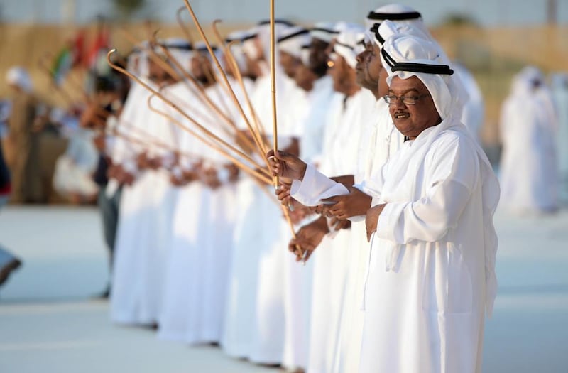 Entertainers perform a traditional Emirati dance at the ninth mass wedding in the Western Region.