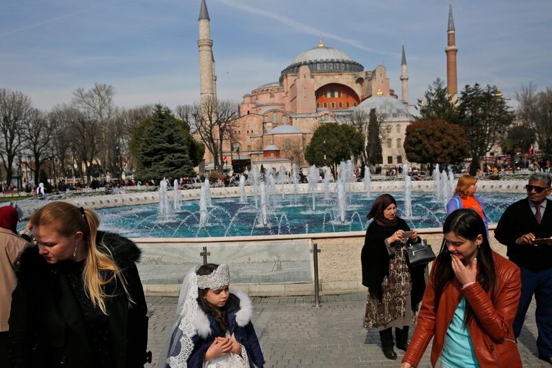 People walk by the Byzantine-era Hagia Sophia, one of Istanbul's main tourist attractions, in March 2017. Turkey’s top administrative court announced its decision to revoke the 1,500-year-old former cathedral’s status as a museum. AP Photo