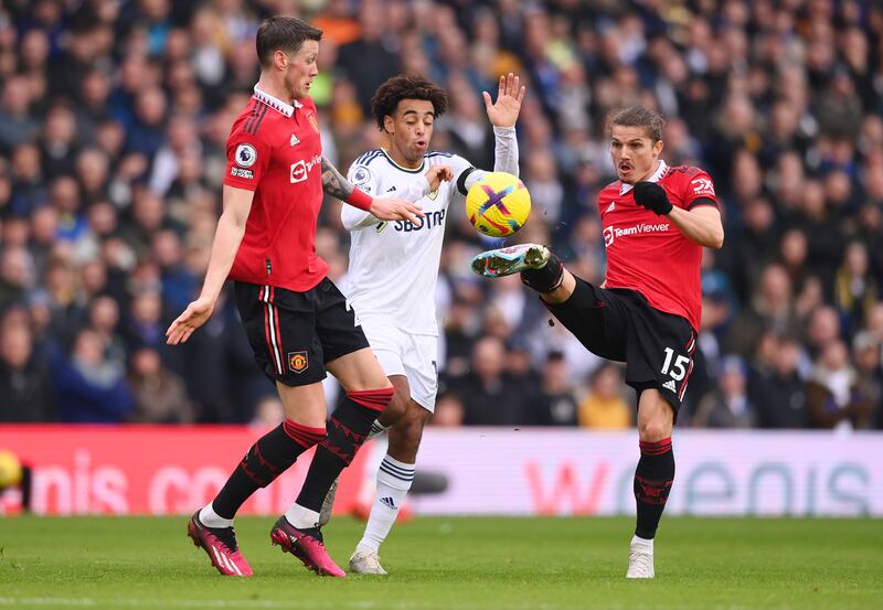 Marcel Sabitzer and Wout Weghorst of Manchester United battle for possession with Tyler Adams of Leeds. Getty 