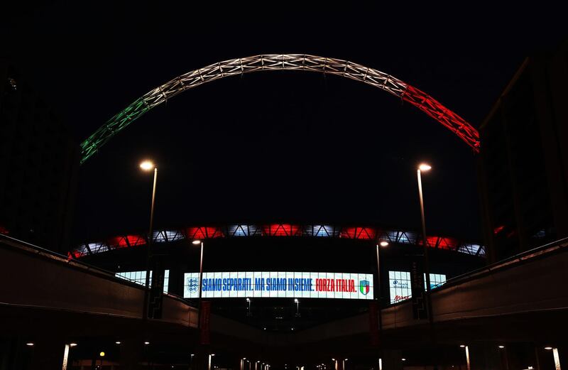 The Wembley arch in London is lit up in the colours of the Italian flag as a gesture of solidarity from the England Football Team. PA Photo. Picture date: Friday March 27, 2020. The arch will remain lit for 90 minutes to coincide with what would have been the Heads Up International between England and Italy tonight (Friday March 27, 2020). See PA story SPORT Coronavirus. Photo credit should read: Adam Davy/PA Wire