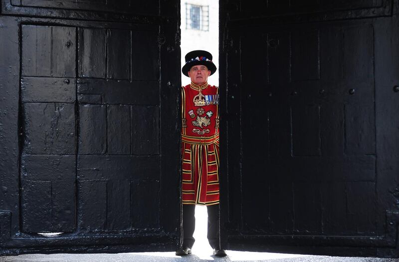A Beefeater opens the West Door during the reopening of the Tower of London in London, Britain. EPA