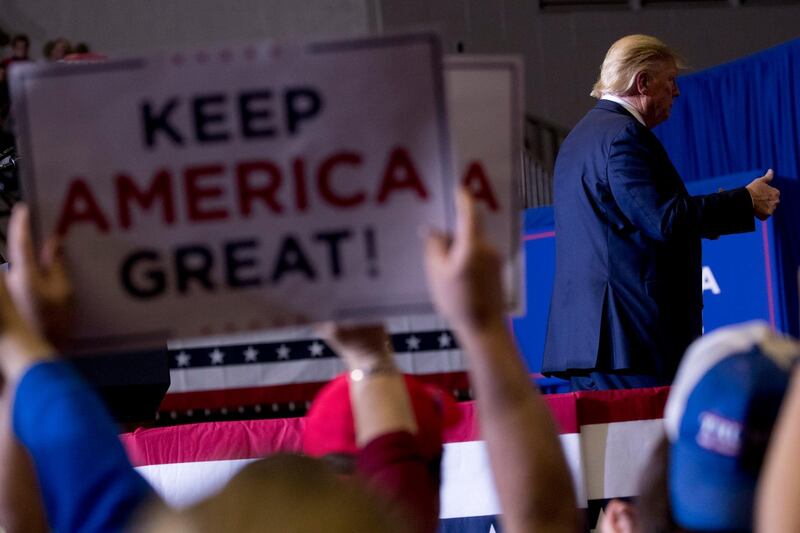 President Donald Trump finishes as speech at a rally at BancorpSouth Arena in Tupelo, Miss., AP