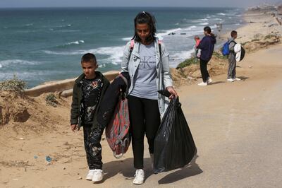 Palestinians flee north Gaza after Israeli troops raided Al Shifa Hospital. Reuters