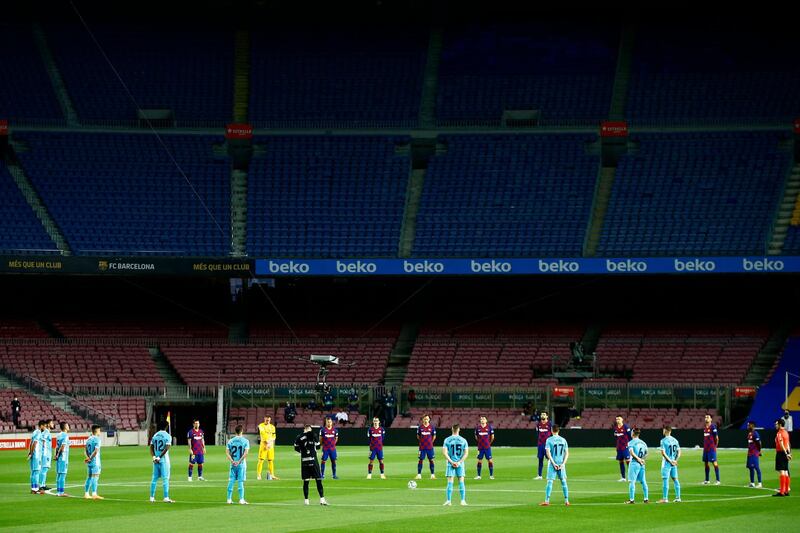 Barcelona and Leganes players hold a minute of silence prior to the match. AP Photo