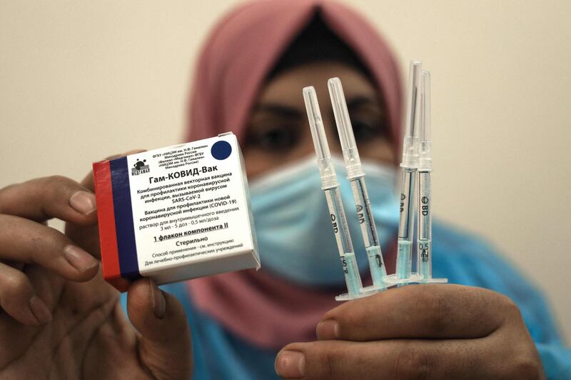 A Palestinian health worker shows a box of the Russian Sputnik V COVID-19 vaccine in Gaza City. AFP