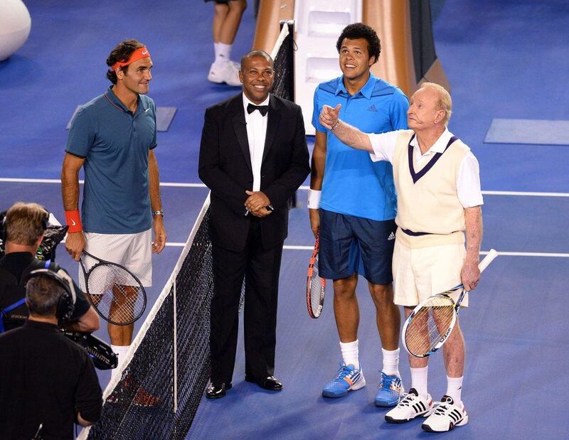 Laver flipping a coin before the exhibition match between Federer and Jo-Wilfried Tsonga on Wednesday. William West / AFP