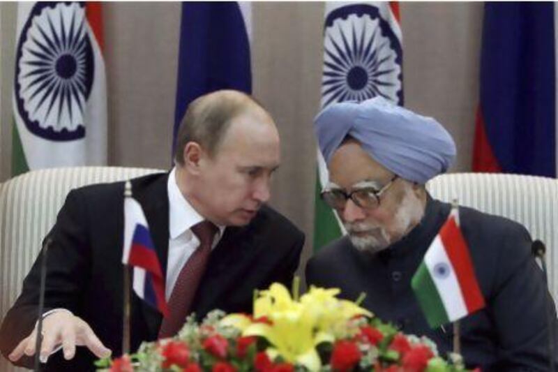 Russia’s Vladimir Putin (left) and India’s Manmohan Singh address the media after announcing yesterday’s arms deal.