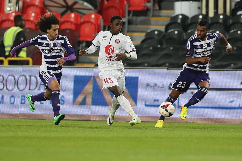 Al Jazira’s Ahmed Al Ghilani, centre, will meet some familiar foes in Al Ain’s Omar Abdulrahman, left, and Mohamed Ahmad in the Asian Champions League knockout stage next month. Al Ittihad

