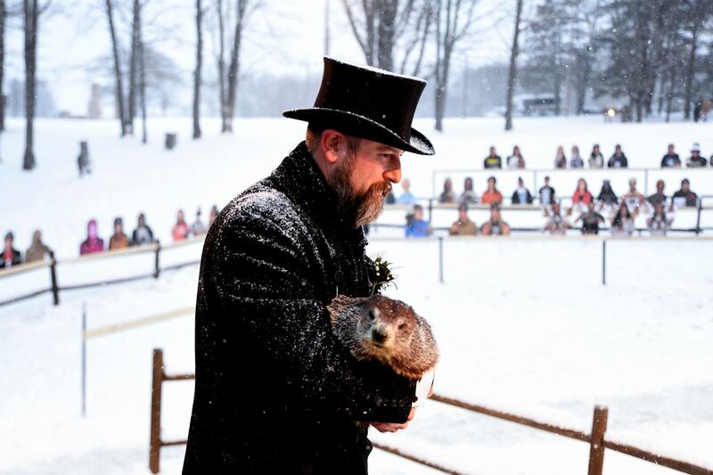 Groundhog Club handler AJ Dereume holds Punxsutawney Phil, the weather prophesying groundhog, during the 135th celebration of Groundhog Day at Gobbler's Knob in Punxsutawney, Pennsylvania. AP
