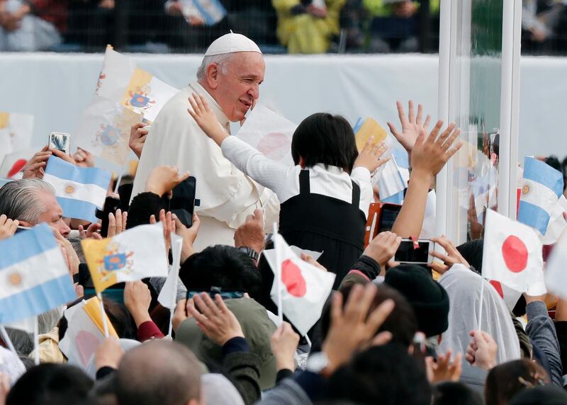 epa08021446 Pope Francis waves to well-wishers as he enters the venue of a holly mass at a baseball stadium in Nagasaki, southwestern Japan, 24 November 2019. The pope is on a four-day visit to Japan, the first in 38 years and only the second in history.  EPA/KIMIMASA MAYAMA