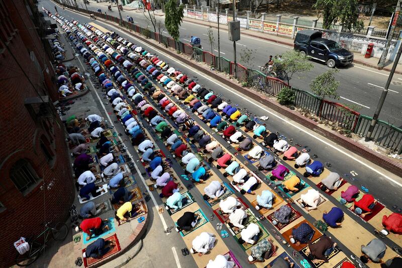 Muslims pray on the street in front of a mosque in Dhaka, Bangladesh. Reuters