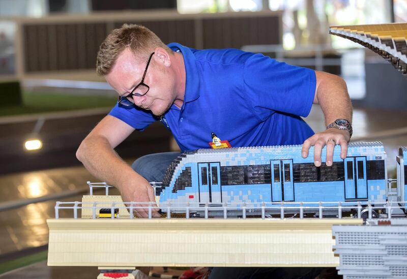 Dubai, United Arab Emirates - November 29th, 2017: PHOTO PROJECT. James Bailey inspects the lego buildings in Mini land. Wednesday, November 29th, 2017 at Legoland, Dubai. Chris Whiteoak / The National