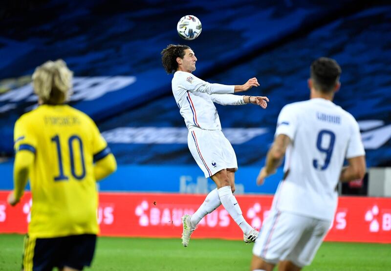 France's Adrien Rabiot heads the ball. EPA