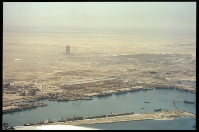 A bird's-eye view from above Port Rashid toward the construction site of the World Trade Centre, 1977 by Mark Harris. Photo: John R Harris Library