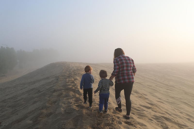 Dubai, United Arab Emirates - Reporter: N/A. News. Weather. A family go for an early morning walk in the desert during heavy fog in Dubai. Saturday, February 13th, 2021. Dubai. Chris Whiteoak / The National