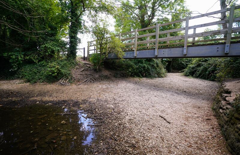 A view of a dried up river bed of the River Thames near to Cirencester in Gloucestershire. PA