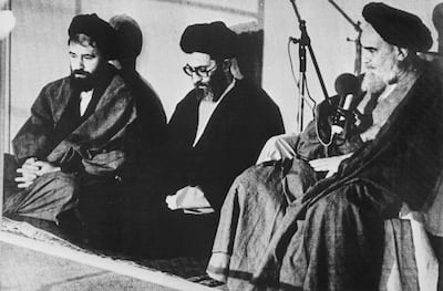 Ayatollah Ruhollah Khomeini, right, with Ayatollah Ali Khamenei, centre, in Tehran in 1981. AFP