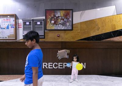 SHARJAH, UNITED ARAB EMIRATES. 31 JULY 2019. 
A girl plays inside Tiger building reception in Al Nahda neighborhood in Sharjah.
(Photo: Reem Mohammed/The National)

Reporter:
Section: