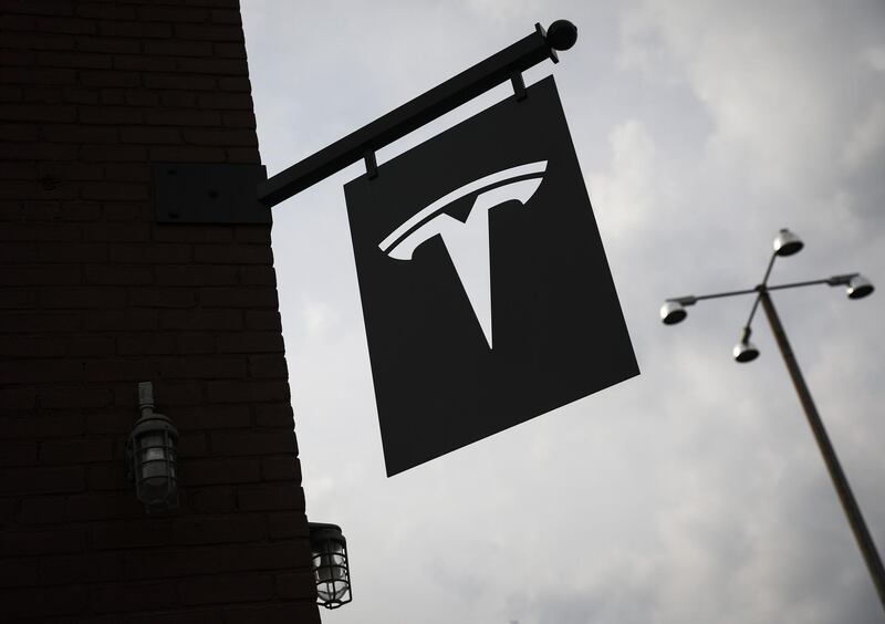 (FILES) In this file photo taken on August 7, 2018, a Tesla dealership stands in the Red Hook neighborhood in Brooklyn, August 7, 2018 in New York City. - Tesla's board of directors said on Agust 14, 2018, it formed a special committee to consider chief executive Elon Musk's proposal to take the electric auto giant private. (Photo by Drew Angerer / GETTY IMAGES NORTH AMERICA / AFP)