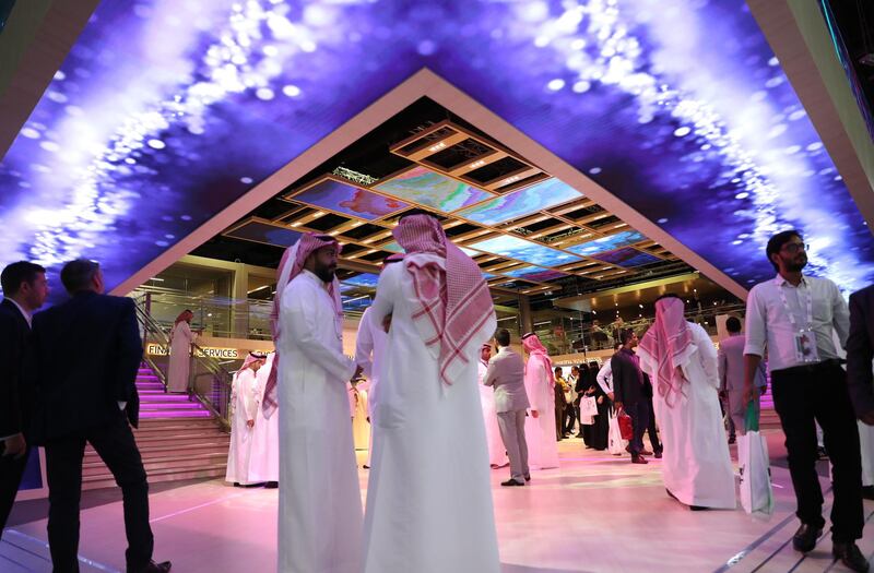 Visitors gather at the Saudi Telecommunication Company section at GITEX 2019 in Dubai. EPA