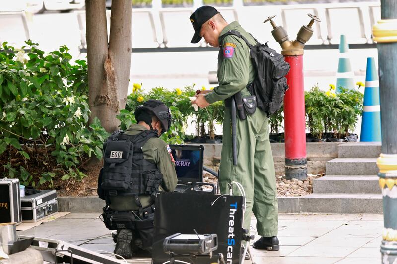 Police Explosive Ordnance Disposal (EOD) officers work following a small explosion at a site in Bangkok, Thailand. REUTERS