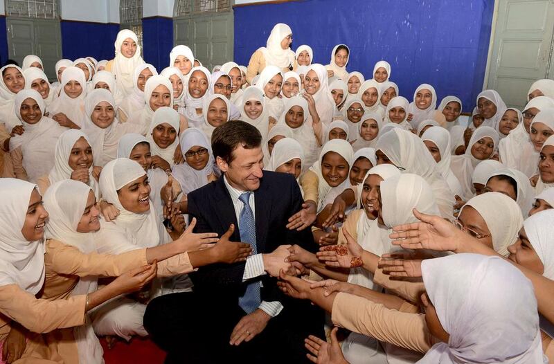 US Consul General Thomas Vajda meets students at the Anjuman-E-Islam school during an educational outreach visit in Ahmedabad.  Sam Panthaky / AFP
