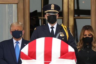 US President Donald Trump and First Lady Melania Trump pay their respects to Justice Ruth Bader Ginsburg as her casket lies in repose at the top of the steps of the US Supreme Court building in Washington on September 24, 2020. Reuters