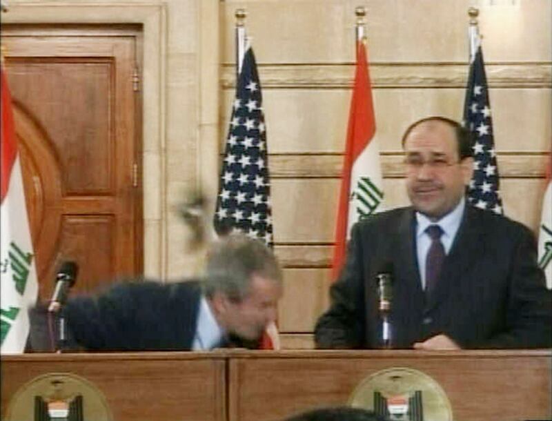 December 14, 2008: Mr Bush makes his final visit to Iraq to sign a co-operation agreement between Iraq and the US known as the Strategic Framework Agreement. At a press conference with Nouri Al Maliki, Munthadar Al Zaidi, a journalist, throws his shoes at Mr Bush. Mr Al Zaidi is severely beaten and jailed for six months. Reuters