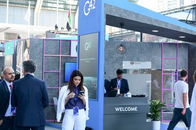 The G42 stand at the Abu Dhabi Finance Week being held at Abu Dhabi Global Market Square. Khushnum Bhandari / The National
