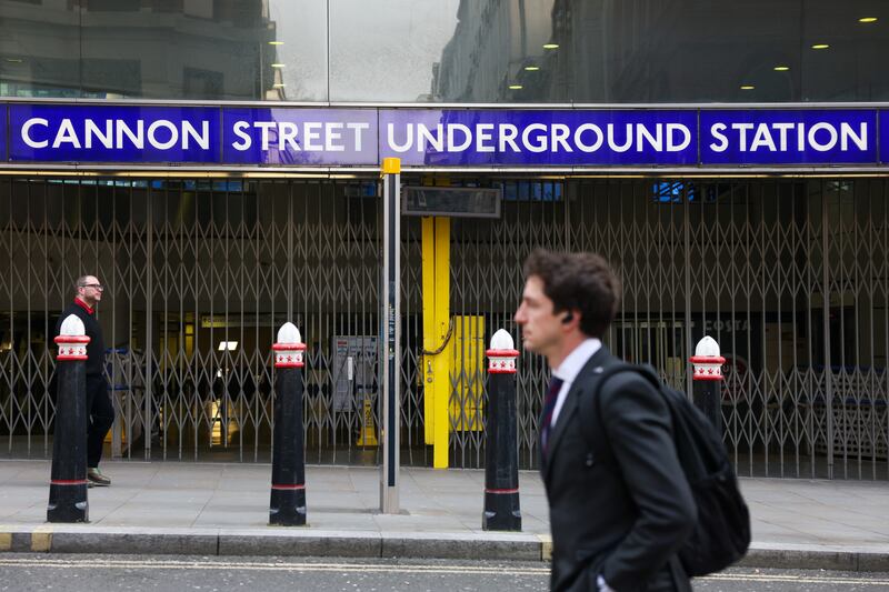 A commuter passes a closed entrance to Cannon Street underground station. Bloomberg