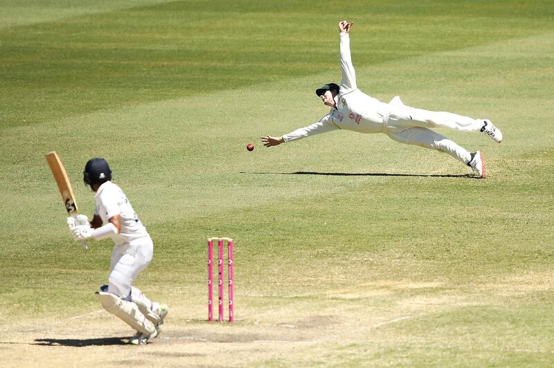 Steve Smith of Australia dives for the ball during day five of the Third Test match in the series between Australia and India at Sydney Cricket Ground. Getty Images