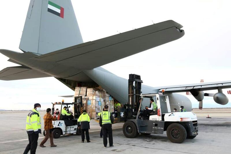 A handout picture released by the World Health Organization (WHO) on March 2, 2020, shows labourers unloading medical equipment and coronavirus testing kits provided bt the World Health Organisation, from a United Arab Emirates military transport plane upon their arrival at Mehrabad International Airport in Iran's capital Tehran. - A plane carrying UN medical experts and aid touched down in Iran on a mission to help it tackle the world's second-deadliest outbreak of coronavirus as European powers said they would send further help. (Photo by - / World Health Organization / AFP) / == RESTRICTED TO EDITORIAL USE - MANDATORY CREDIT "AFP PHOTO / HO / WHO" - NO MARKETING NO ADVERTISING CAMPAIGNS - DISTRIBUTED AS A SERVICE TO CLIENTS ==