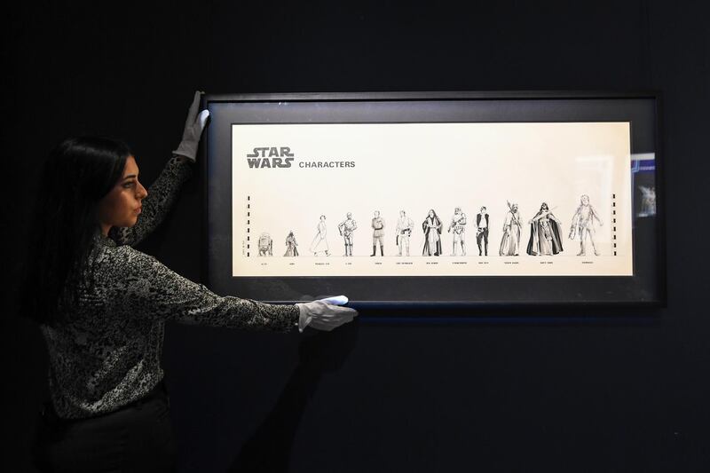 A Sotheby's employee adjusts 'The Empire Strikes Back' Special character gauge of 1978-79, as part of the Star Wars auction in London. Sotheby's will now host its second sale dedicated to 'Star Wars' collectibles, titled 'Star Wars Online'. AP Photo