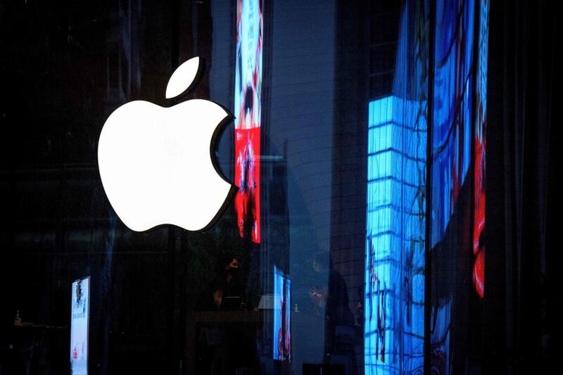 The Apple logo is seen on the window of the newly opened company store in Bangkok on September 23, 2020. / AFP / Mladen ANTONOV
