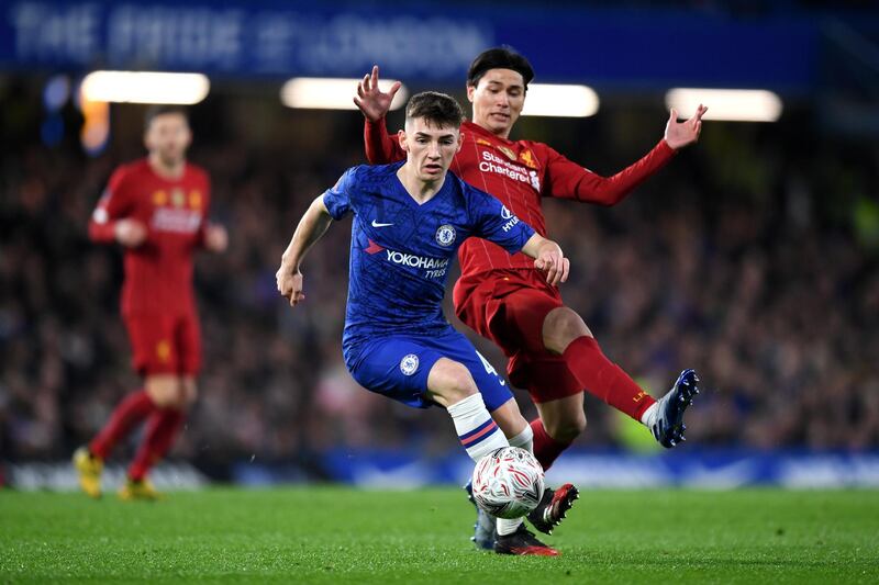 Chelsea midfielder Billy Gilmour shields the ball from Liverpool forward Takumi Minamino during the FA CUp fifth round match at Stamford Bridge. Getty Images