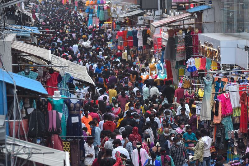 People crowd Ranganathan Street, Chennai, on World Population Day.  World Population Day is observed every year on 11 July to raise awareness of global overpopulation.   EPA