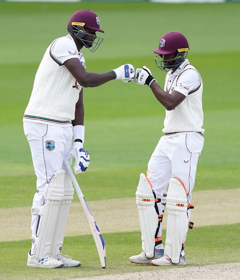 West Indies' Jason Holder, left, and Shamarh Brooks during day five of the Manchester Test on Monday. PA