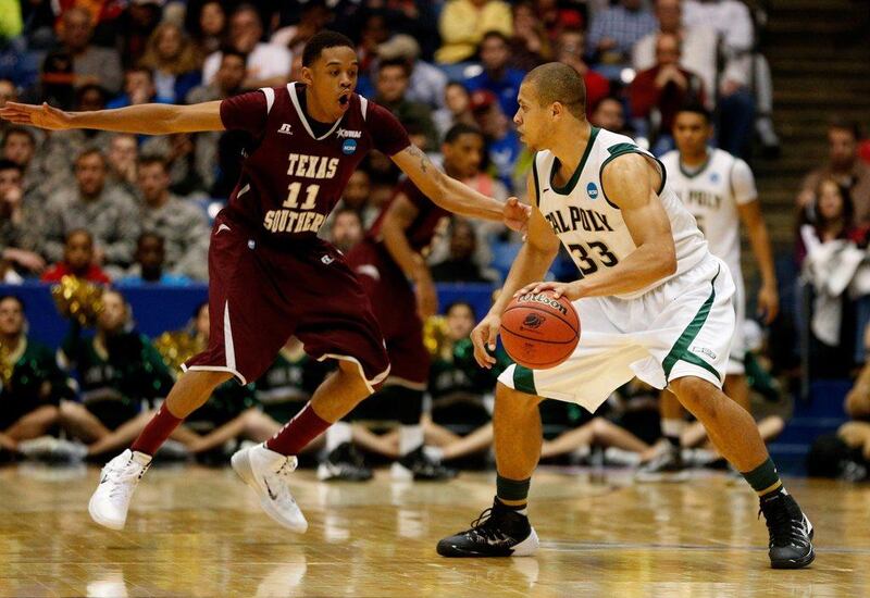 Cal Poly, in white, made it into the NCAA Tournament proper by beating Texas Southern, in red, in a play-in game on March 19, 2014. Gregory Shamus / Getty Images / AFP