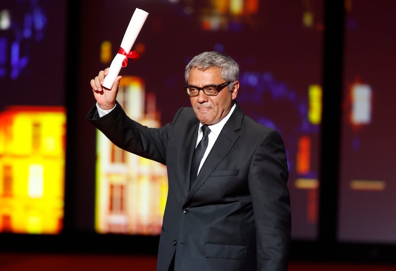 Mohammad Rasoulof accepts a Special Prize for The Seed of the Sacred Fig at the Cannes Film Festival. EPA