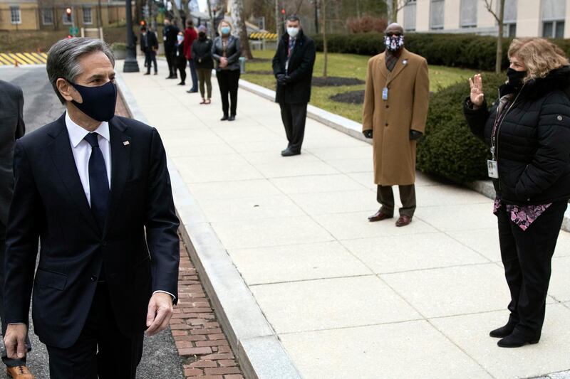 Secretary of State Antony Blinken is greeted by staff as he arrives at the State Department in Washington, Wednesday,  Jan. 27, 2021. (Carlos Barria/Pool Photo via AP)