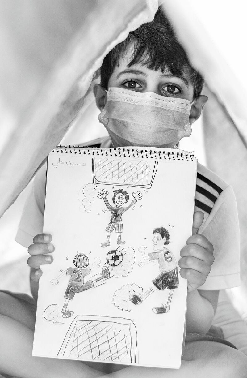 'Wish' by Hanan Rajab from Bahrain shows a child with a drawing about his hopes to leave self-isolation. The photo received the runner-up prize for the first week of Xposure's #HomeCaptured contest on April 22. Hanan Rajab 