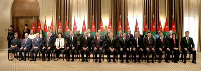 Jordan's King Abdullah II sits as he poses with ministers during a swearing-in ceremony of the new cabinet in Amman, Jordan June 14, 2018. Jordanian Royal Palace/Handout via Reuters ATTENTION EDITORS - THIS IMAGE HAS BEEN SUPPLIED BY A THIRD PARTY. FOR EDITORIAL USE ONLY.
