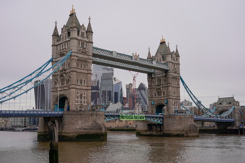 The bridge, a main traffic artery across the Thames, was closed to vehicles, causing long queues. AP Photo