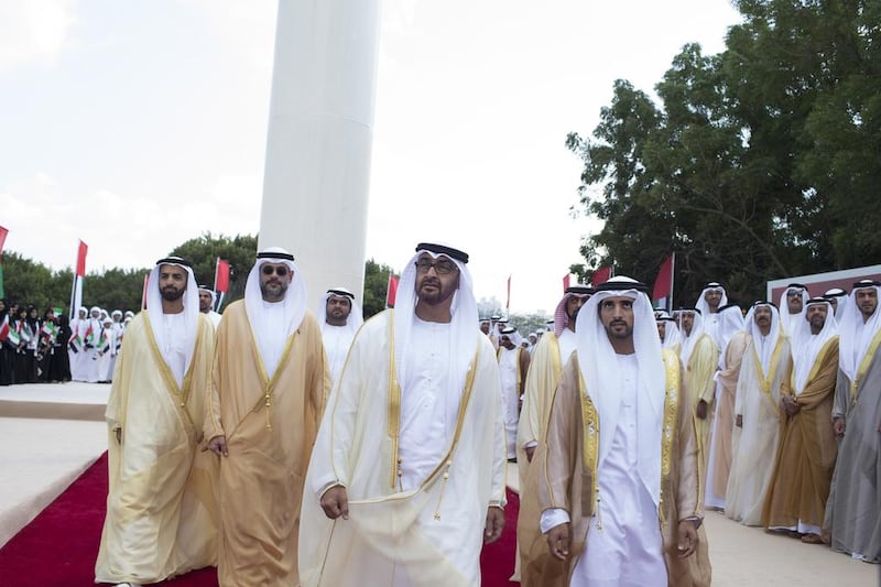 Sheikh Mohammed bin Zayed, Crown Prince of Abu Dhabi and Deputy Supreme Commander of the UAE Armed Forces, left, and Sheikh Hamdan bin Mohammed, Crown Prince of Dubai, right, attend a flag raising ceremony at the Breakwater. Also in the picture are (back row left to right) Sheikh Mohammed bin Saud bin Saqr Al Qasimi, Crown Prince and Deputy Ruler of Ras A Khaimah, Sheikh Sultan bin Mohammed Al Qasimi Crown Prince of Sharjah, Sheikh Mohammed bin Hamad Al Sharqi, Crown Prince of Fujairah, and Sheikh Ammar bin Humaid Al Nuaimi, Crown Prince of Ajman. Ryan Carter / Crown Prince Court - Abu Dhabi 