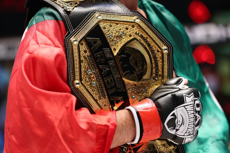 Mohammad Yahya holds the his UAE Warriors Arabia Lightweight title belt after beating Mohamed El Jaghdal. Chris Whiteoak / The National