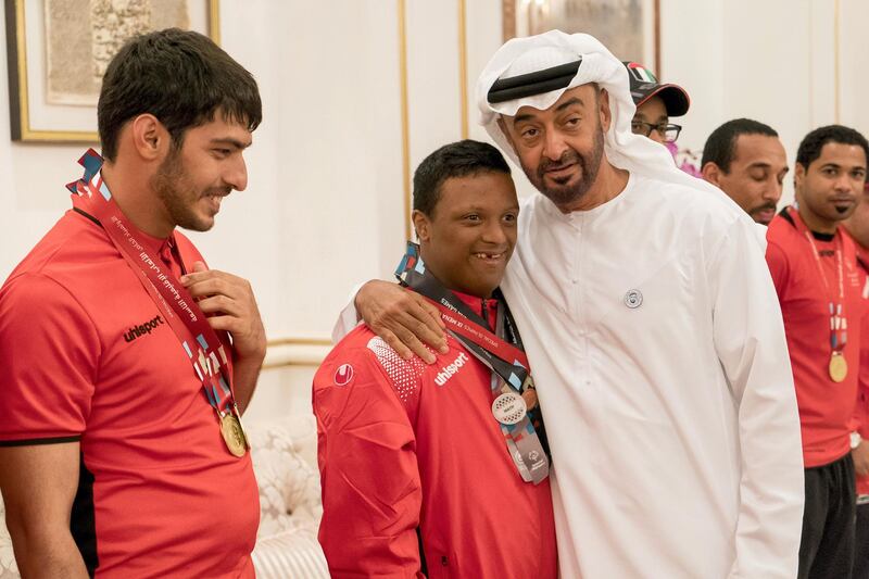 ABU DHABI, UNITED ARAB EMIRATES - April 09, 2018: HH Sheikh Mohamed bin Zayed Al Nahyan, Crown Prince of Abu Dhabi and Deputy Supreme Commander of the UAE Armed Forces (R), receives members of the UAE Special Olympics team, during a Sea Palace barza.

( Rashed Al Mansoori / Crown Prince Court - Abu Dhabi )
---