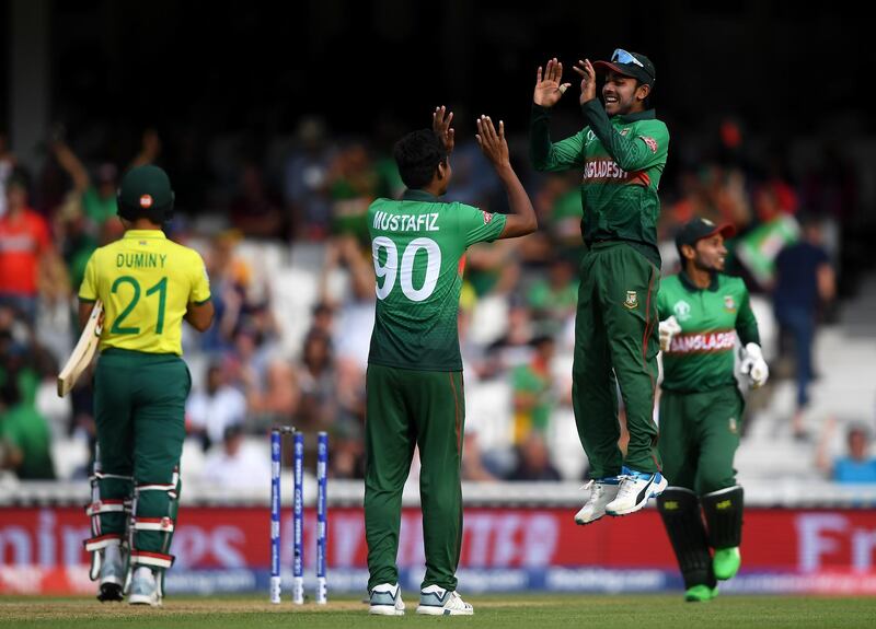 LONDON, ENGLAND - JUNE 02:  Mustafizur Rahman of Bangladesh (c) celebrates the wicket of JP Duminy of South Africa (l) with Mehedi Hasan of Bangladesh (r) during the Group Stage match of the ICC Cricket World Cup 2019 between South Africa and Bangladesh at The Oval on June 02, 2019 in London, England. (Photo by Alex Davidson/Getty Images)