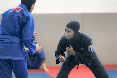 ABU DHABI, UNITED ARAB EMIRATES - AUGUST 14, 2018. 

Hessa Al Shamsi, in black, of the UAE Jiu Jitsu national team, trains for the Asian Games 2018.

(Photo by Reem Mohammed/The National)

Reporter: AMITH PASSATH
Section:  SP