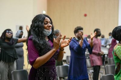 Redeemed Christian Congregation of God parish members clapping to the hymns at Sunday morning mass. Khushnum Bhandari / The National